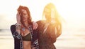 Live a free spirited life. two young women spending the day at the beach at sunset.