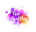 Live healthy calligraphy on paint splash background