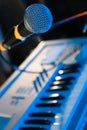 Live music setup with microphone and keyboard background Royalty Free Stock Photo