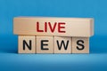 Live News symbol. Wooden blocks with words 'Live News'.