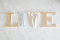 Text LIVE made with wooden letters, vintage retro style