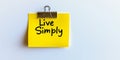 Live Simply Concept Isolated Yellow Sticky Note With Inspirational Message On White Background Royalty Free Stock Photo
