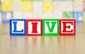 Live Spelled Out in Alphabet Building Blocks Royalty Free Stock Photo