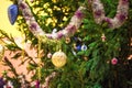 live spruce decorated with Christmas toys, garlands and balls outdoor, new year Royalty Free Stock Photo