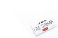 Live streaming concept - words on paper tablet on white top view Royalty Free Stock Photo