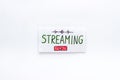Live streaming concept - words on paper tablet on white top view Royalty Free Stock Photo