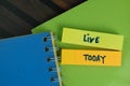 Live Today write on sticky notes write on a sticky notes isolated on Wooden Table Royalty Free Stock Photo