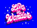 Live in wonder, trendy creative vector typography greetings design. Modern script lettering in vivid blue and pink colors