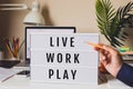 Live Work Play concepts with text on light box on desk table in home office.Life balance.positive emotion