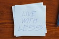 Live with less written on a note