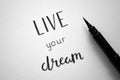 LIVE YOUR DREAM hand-lettered in notebook Royalty Free Stock Photo