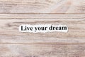 Live your dream of the word on paper. concept. Words of live your dream on a wooden background Royalty Free Stock Photo