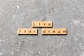 Live your dream word written on wood block. live your dream text on cement table for your desing, concept Royalty Free Stock Photo