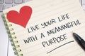 Live your life with meaningful purpose, text words typography written on paper, life and business motivational inspirational