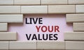 Live your values symbol. Concept words Live your values on wooden blocks. Beautiful pink background. Business and Live your values