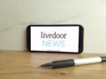 Livedoor News logo displayed on mobile phone