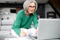 Lively aged woman busy as a bee Royalty Free Stock Photo