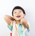 Lively Asian boy is laughing happily on white Royalty Free Stock Photo