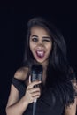 Passionate Black Female Singer with Microphone