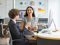 Lively businesswoman happy for job success, enjoy creative talking with company caucasian manager and laugh for funny chat joke on Royalty Free Stock Photo