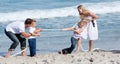 Lively family playing tug of war Royalty Free Stock Photo