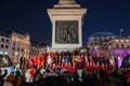 Christmas Santa Gathering at Trafalgar Square, London in the Evening Royalty Free Stock Photo