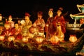 A lively group of people riding on top of a boat adorned with beautiful lanterns, A group of people in glowing lantern festival, Royalty Free Stock Photo