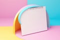 A lively image of a pink and yellow planner set against a vibrant bright blue background. Perfect for organization, crea Royalty Free Stock Photo