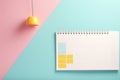 A lively image of a pink and yellow planner set against a vibrant bright blue background. Royalty Free Stock Photo