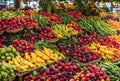 In the lively marketplace, a bounty of exotic tropical fruits is on display, their juicy sweetness and tropical aromas