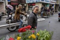 Lively street Asian city, townspeople ride on motorcycles and b