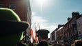 A lively street parade for Saint Patrick& x27;s Day, with people dressed in green costumes and shamrocks, dancing to