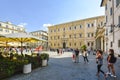 The Piazza Santa Maria in Trastevere in Rome Italy as tourists and locals enjoy the cafes and fountain outside the cathedral.