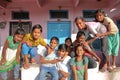 CHITTORGARH, RAJASTHAN, INDIA - DECEMBER 12, 2017: Lively and welcoming children posing in front of a traditional house