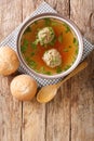 Liver Dumplings are a traditional Bavarian dish severd in a hot brooth close-up in a plate. Vertical top view Royalty Free Stock Photo