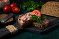 Liver meat pate spread on rye bread, breakfast, close-up, dark background. no people, selective focus, Royalty Free Stock Photo