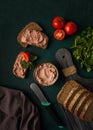 Liver meat pate spread on rye bread, breakfast, close-up, dark background. no people, selective focus, Royalty Free Stock Photo