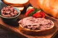 Liver meat pate spread on white bread, on a wooden background, breakfast, close-up, no people, selective focus, Royalty Free Stock Photo