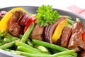 Liver skewer with green beans Royalty Free Stock Photo