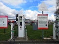 Liverpool, England - APRIL 2 : electric vehicle charging station at service with instructions sign on April 2, 2019 in Liverpool,