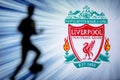 LIVERPOOL, ENGLAND, JULY. 1. 2019: Liverpool Football club logo, Premier League, England. Soccer player silhouette Royalty Free Stock Photo