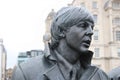 Sculpture of the Beatles on Pier Head, Liverpool, England, in rainy weather. Detail: Portrait of Paul McCartney.