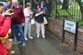 Tourists photograph the street sign of Penny Lane. Liverpool, UK. Royalty Free Stock Photo