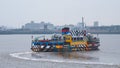 A Mersey passenger ferry leaving Liverpool UK