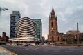 Old church framed by modern architecture, Liverpool, UK