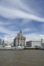 Liverpool, June 2014,  a scene across the River Mersey showing Pier Head, with the Royal Liver Building, Cunard Building and Port Royalty Free Stock Photo