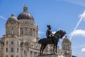 Statue of Edward VII outside the Royal Liver building in Liverpool, England on July 14, 2021 Royalty Free Stock Photo