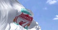 The flag of Liverpool Football Club waving in the wind on a clear day