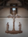 The Rood, hanging above the altar. Jesus hanging on the cross and The Virgin Mary and St.John (The evangelist) statues