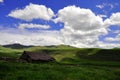 A livestock settlement in the mountainous areas where cattle breeders prepare dairy products during the summer, especially cheese. Royalty Free Stock Photo